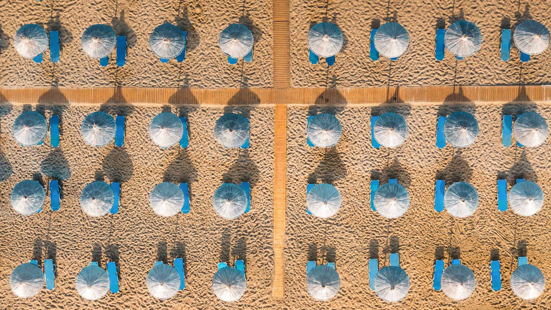Blue sunbeds on a sandy beach in Vai, Crete, Greece (© borchee/Getty Images)