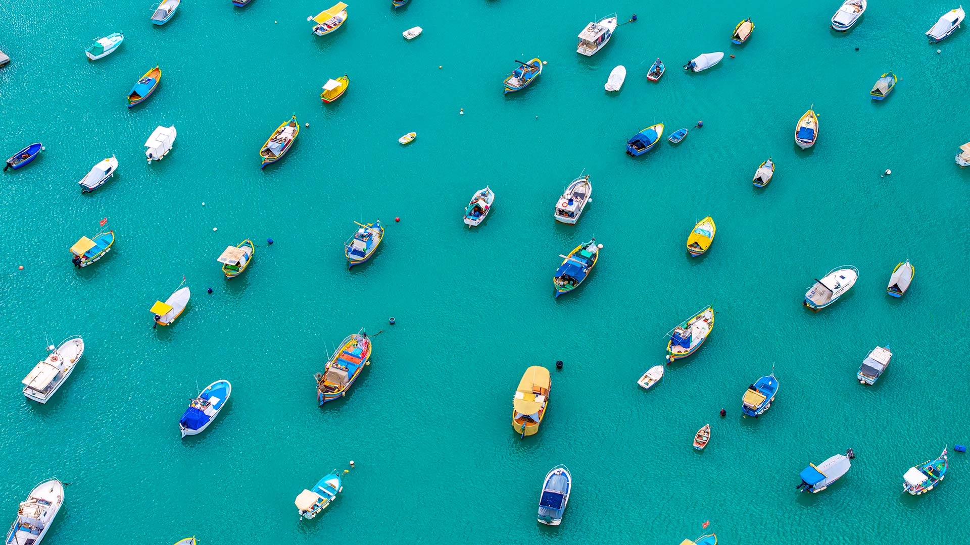 Colourful boats in Marsaxlokk Harbour, Malta (© Klubovy/Getty Images)