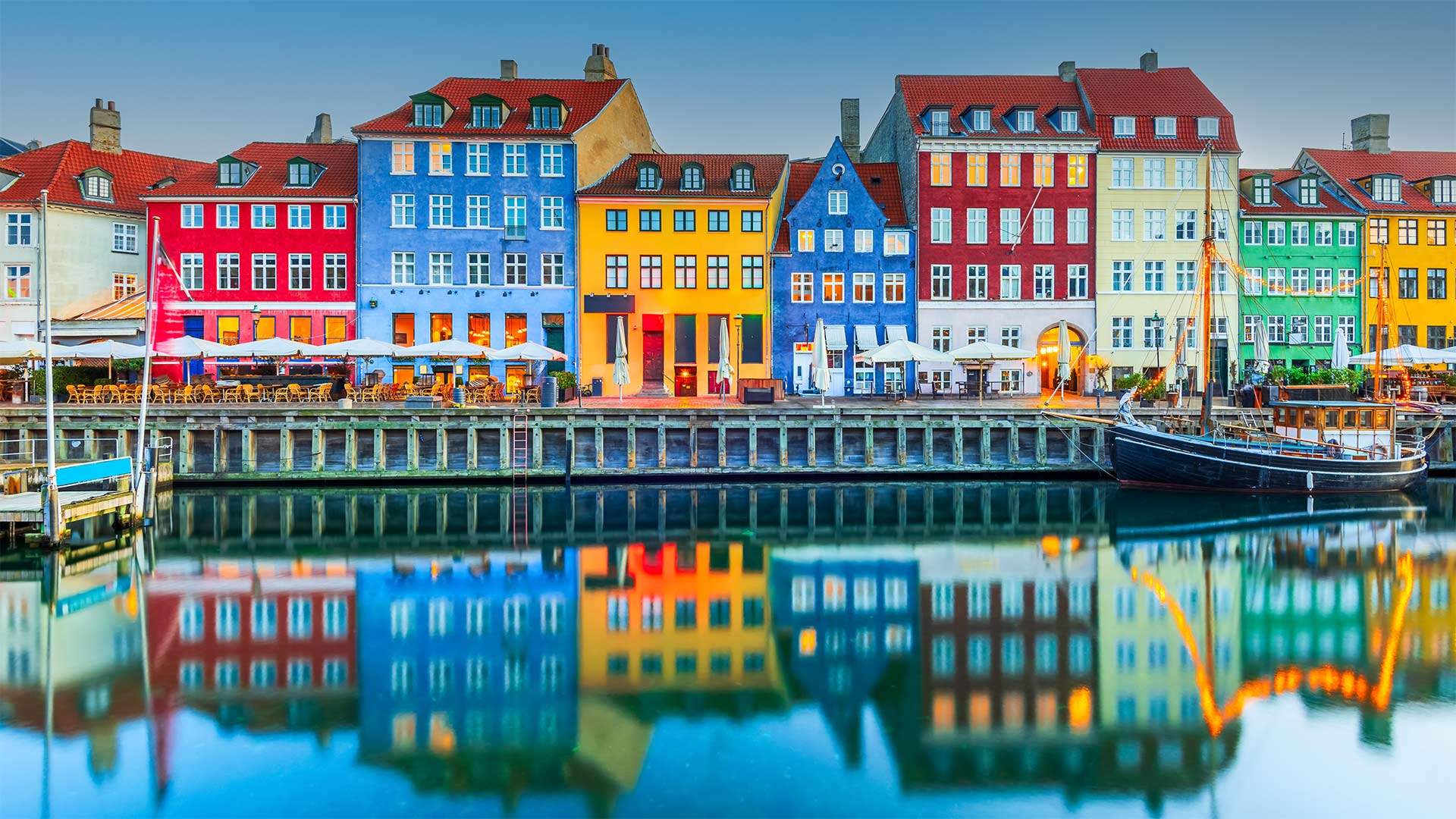 Colourful homes line Nyhavn Canal, Copenhagen, Denmark (© emicristea/Getty Images)