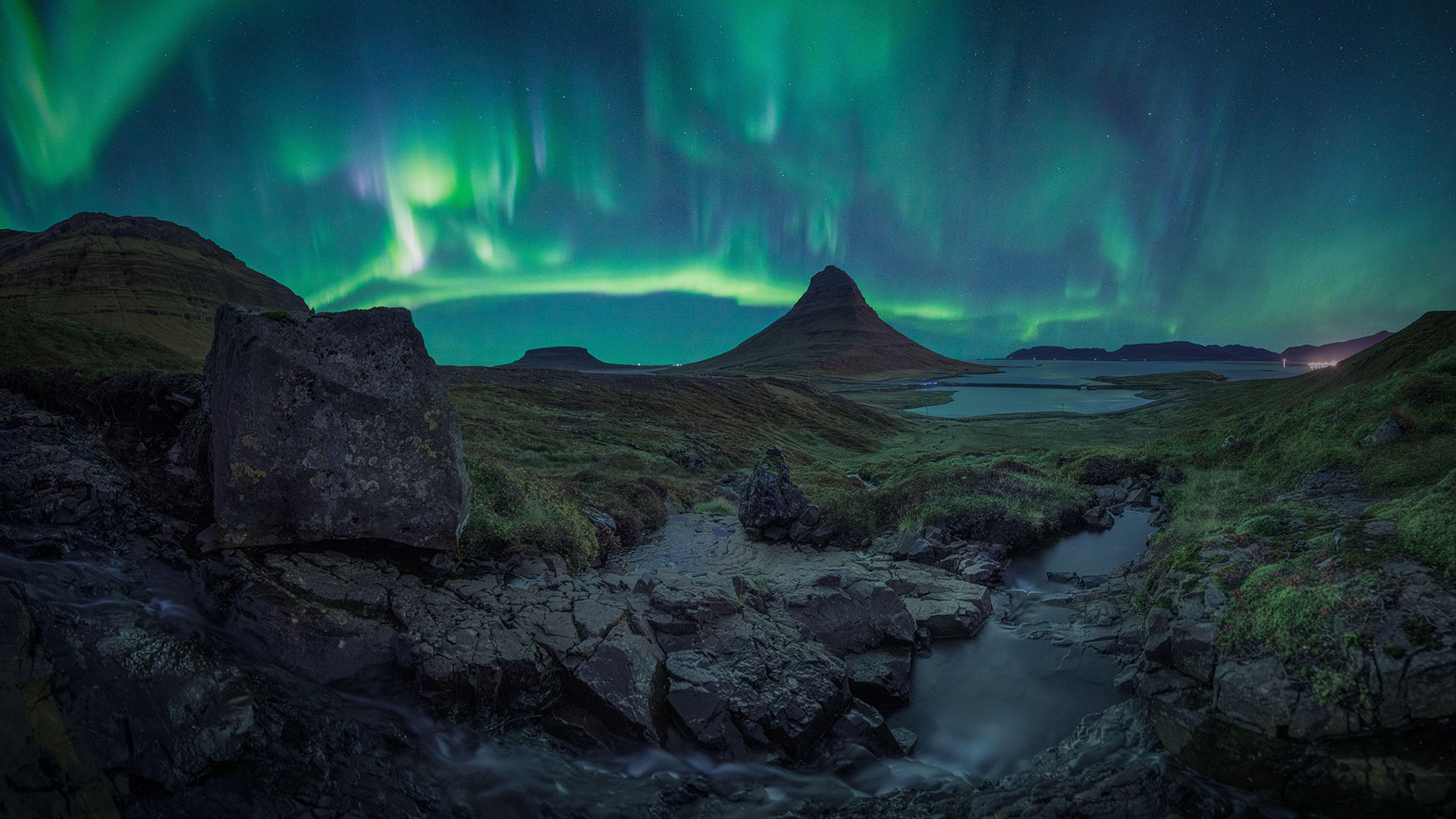 Auroras over Kirkjufell, Iceland (© Cavan Images/Alamy)